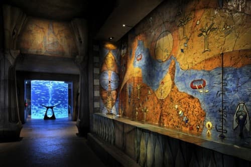 Atlantis-themed aquarium exhibit featuring marine life, part of the Lost Chambers Aquarium's Seven Sages attraction.
