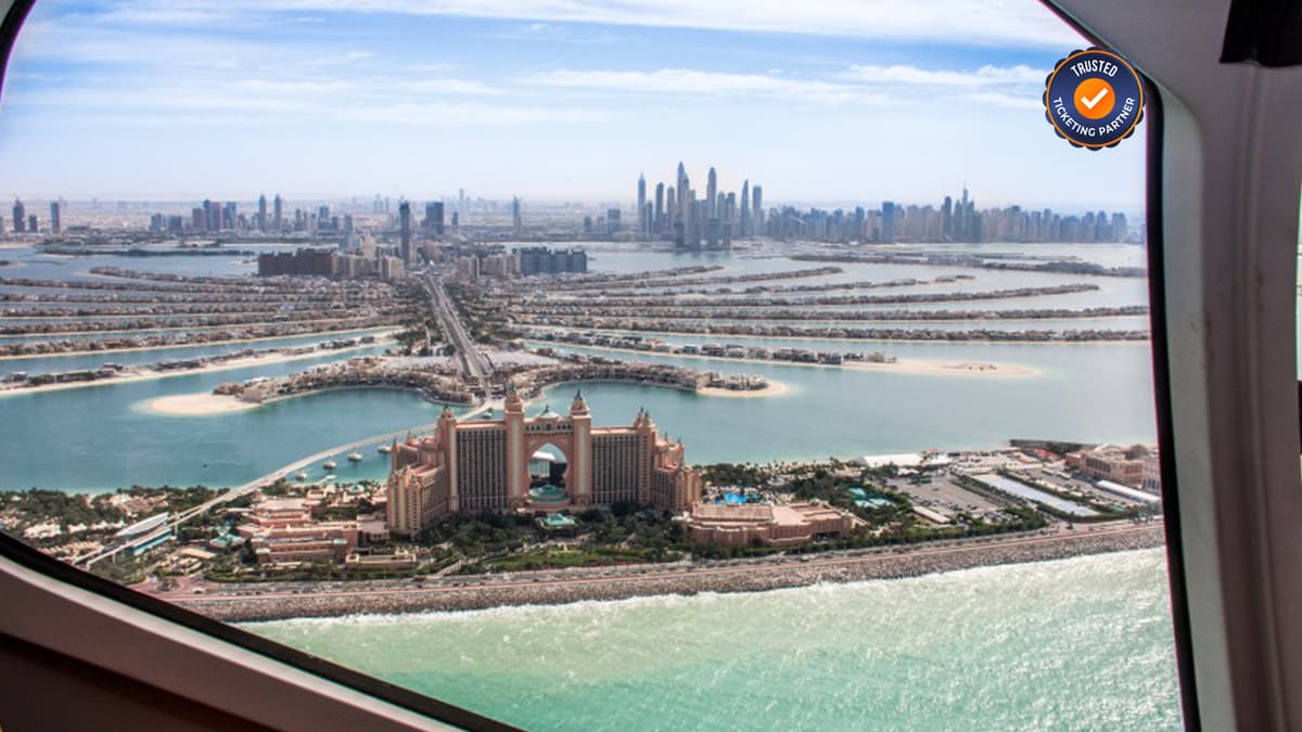 Aerial helicopter view of Palm Jumeirah island and the Dubai coastline.