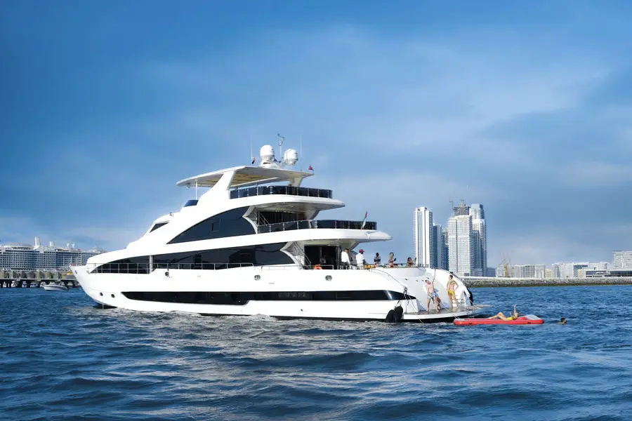 Luxury superyacht sailing through Dubai Marina canal